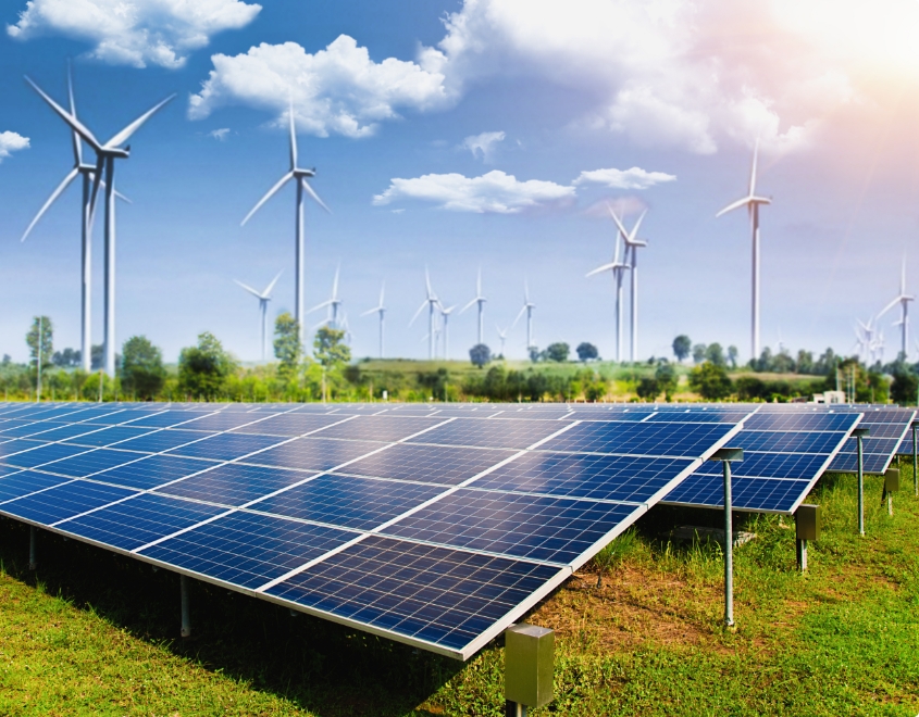 solar-panel-with-wind-turbines-against-mountains-sky.jpg